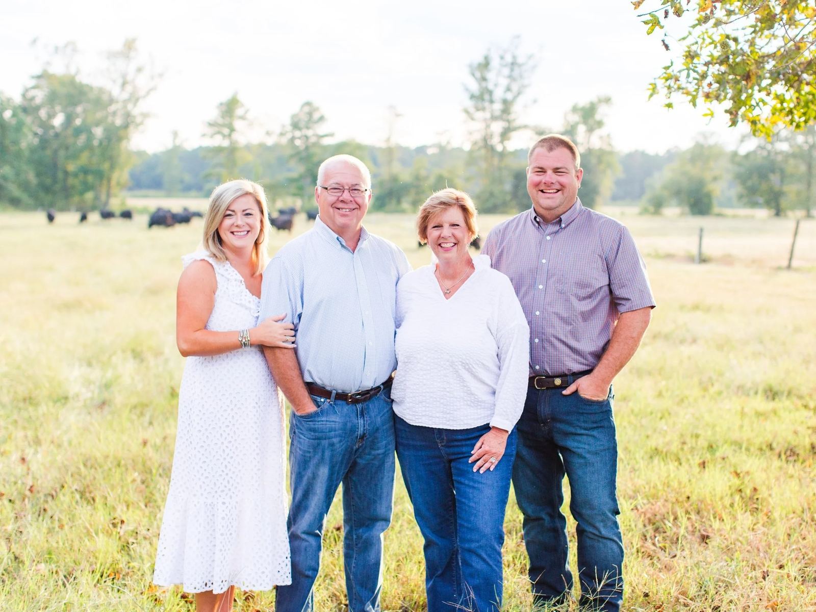 The Jones family standing in their pasture